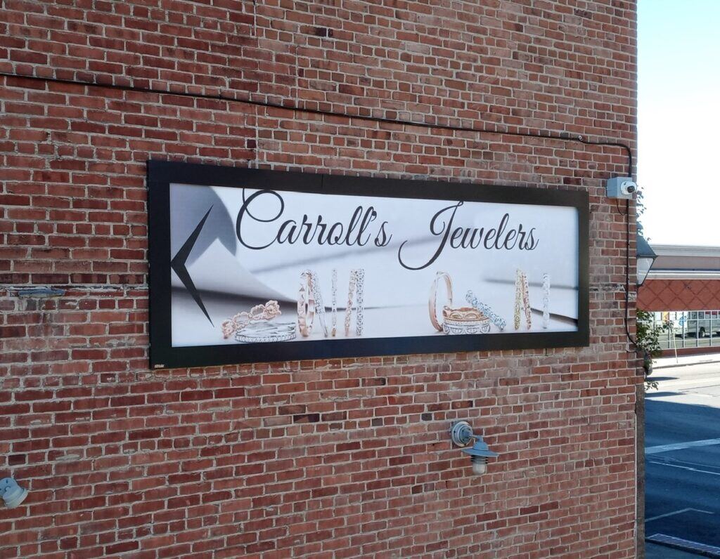 Carolls-Jewelers-Completion-Lind-SignSpring-BannerFrame-Hinge-1024x796