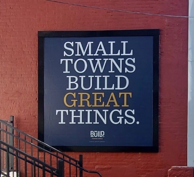 CoWork-Small-Towns-Great-Things-Lind-SignSpring-BannerFrame-Hinge